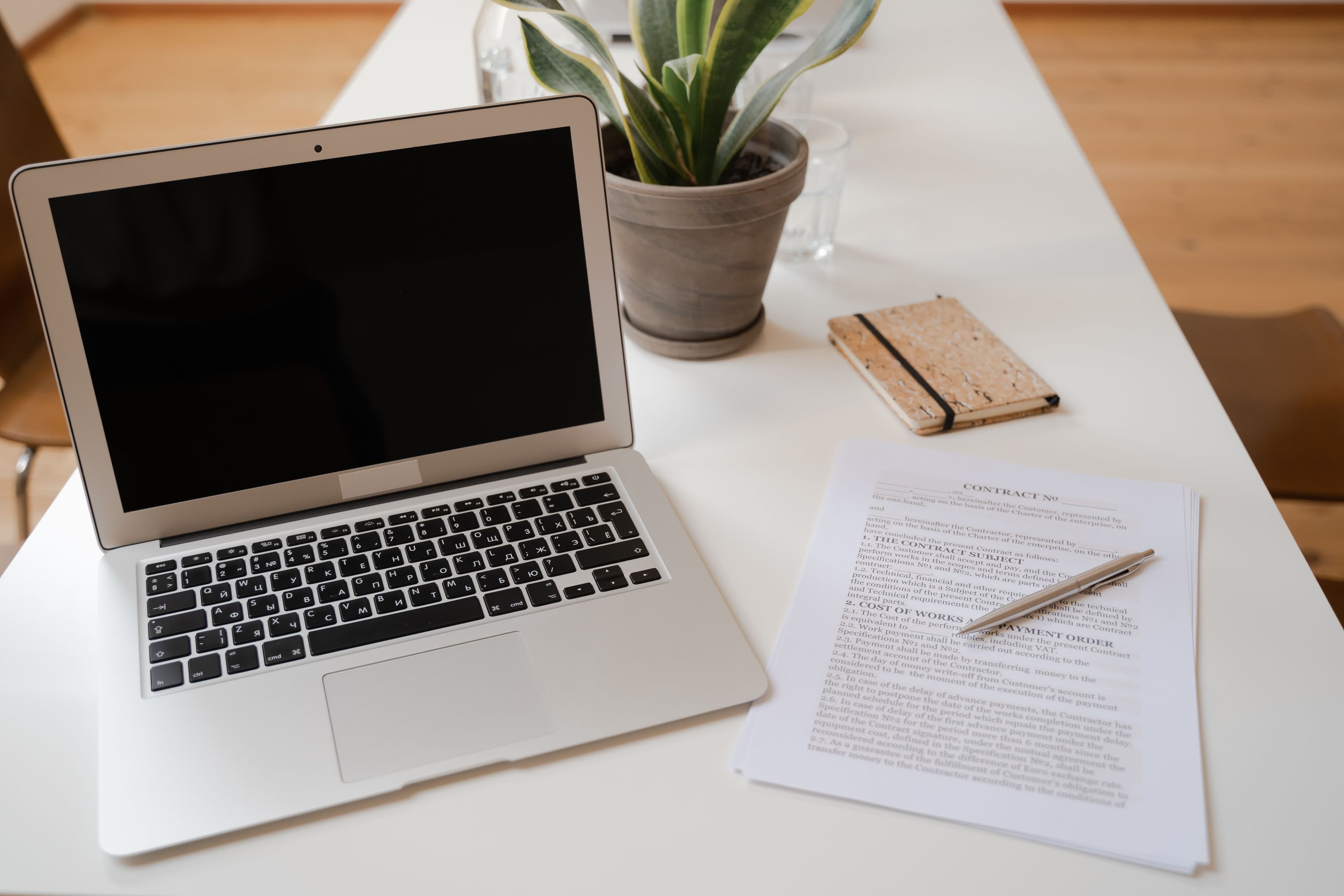 Laptop and documents on a desk representing EU regulatory review