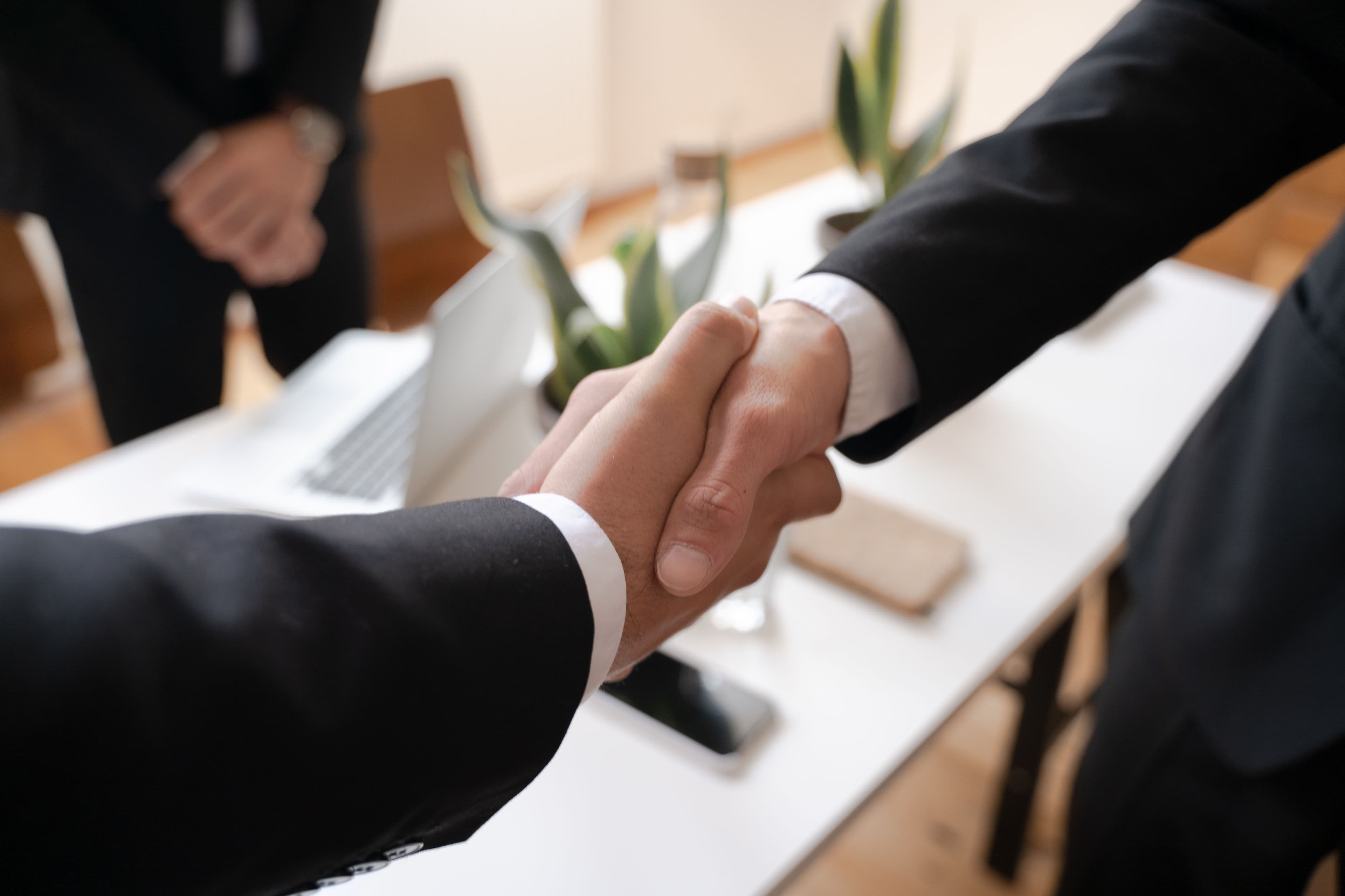 Close-up of a professional handshake after a salary negotiation